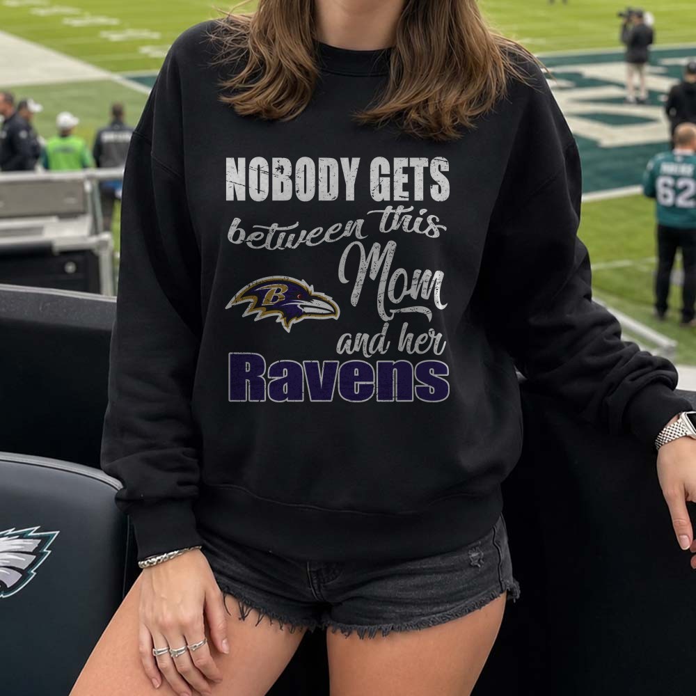 Nobody Gets Between This Mom And Her Ravens Fierce Mother Baltimore Ravens NFL T-Shirt Nobody Gets Between This Mom And Her Ravens Fierce Mother Baltimore Ravens NFL T-Shirt